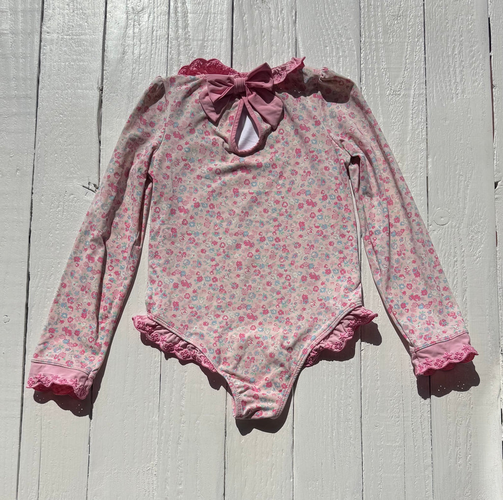 Back of The Beaufort Bonnet Company floral swimsuit with pink bow
